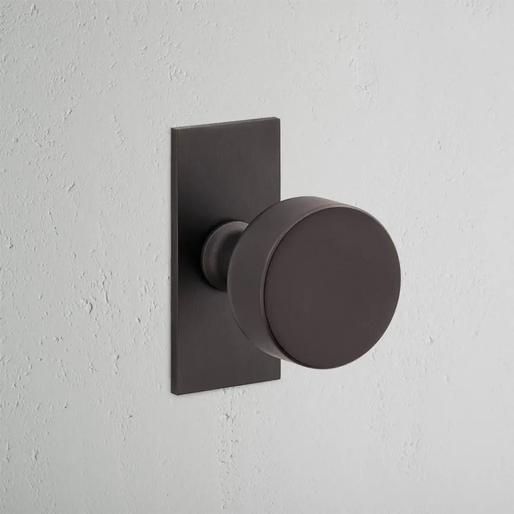 Onslow Short Plate Unsprung Door Knob - Warm finish